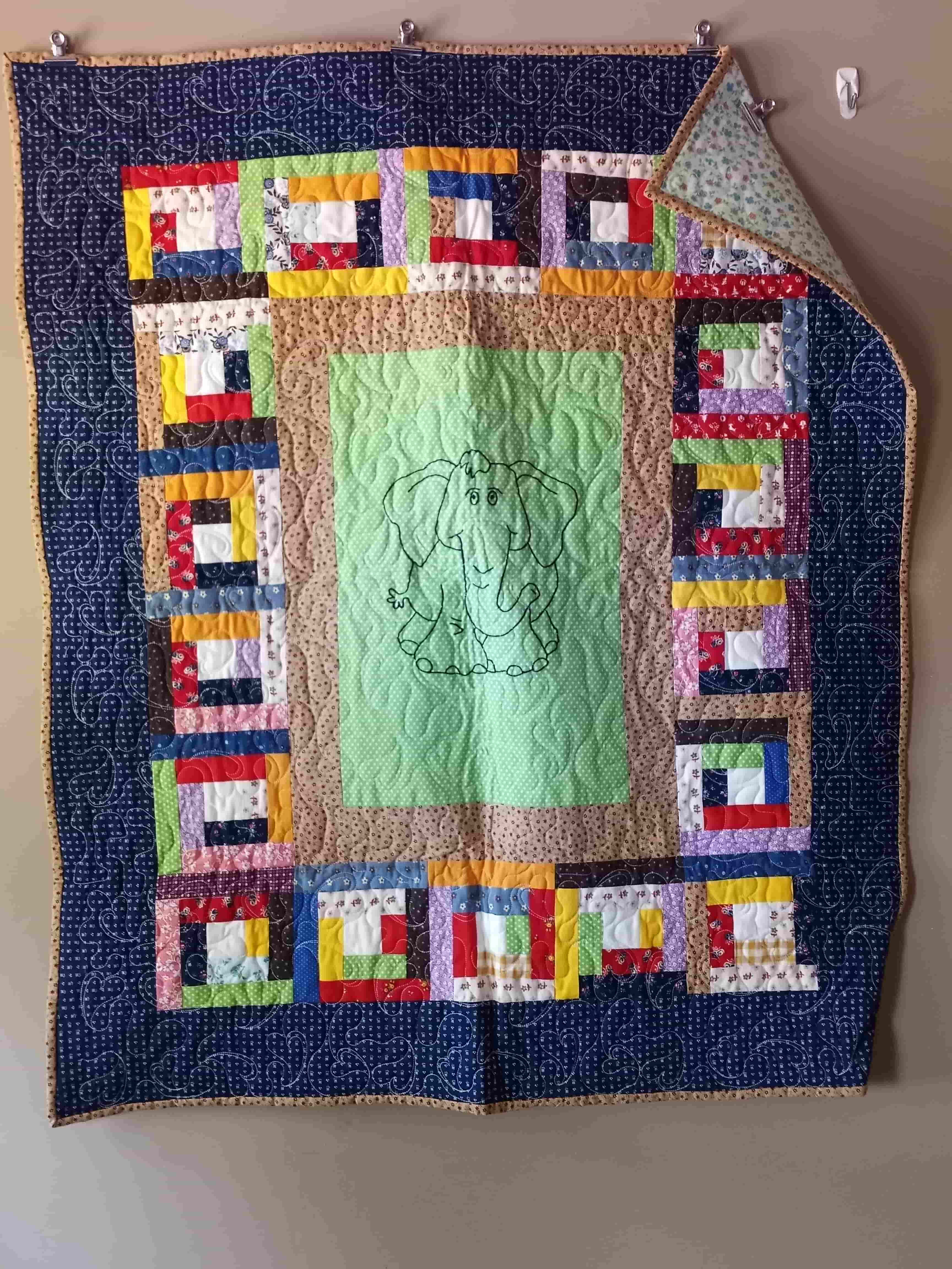 Colorful patchwork quilt with geometric border